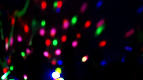 Fitness Class using glow sticks in a dark setting - out of focus - Light Bokeh Video stock 67757823