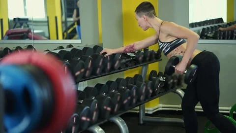 Fitness coach does exercises for the development of the shoulder complex. Stock Footage
