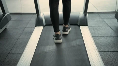 Fitness concept of 4k Resolution. close up feet are running on a treadmill. Stock Footage 150830600