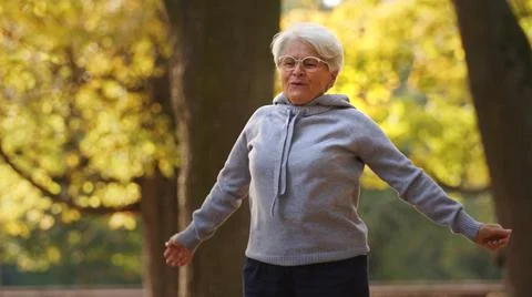 Fitness concept. Being physically active in the old age pays off. Outdoor shot Stock Photos