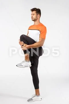 Fitness, endurance and workout concept. Motivated, focused good-looking young Stock Photos