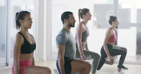 Fitness exercise trainer teaching workout class with smiling active women Stock Footage 204772463