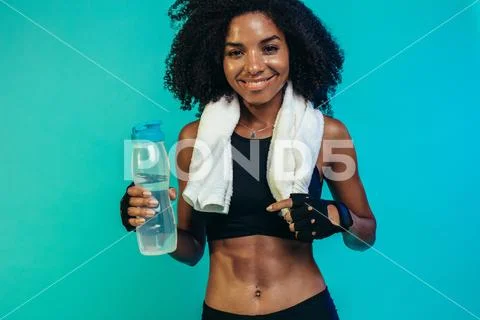 Fitness female taking a break after workout Stock Photos
