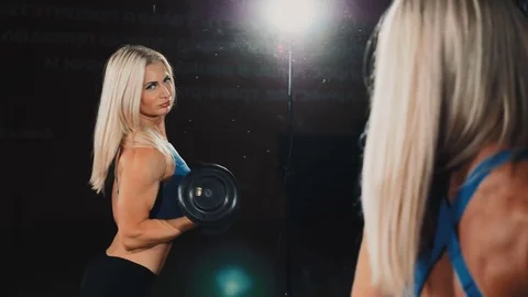 Fitness girl doing exercise in the gym Stock Footage