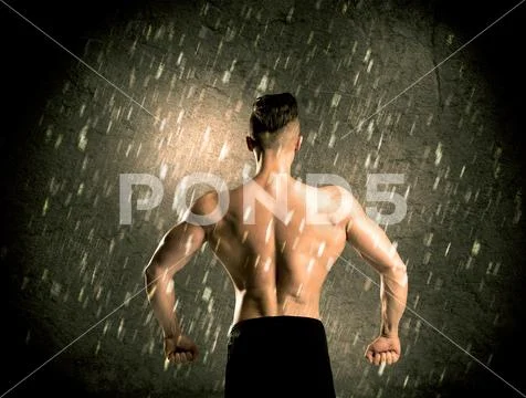Fitness guy with weight showing muscles Stock Photos