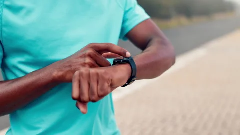 Fitness, hands and man with smart watch outdoor for pace timer, start running Stock Footage 330530164