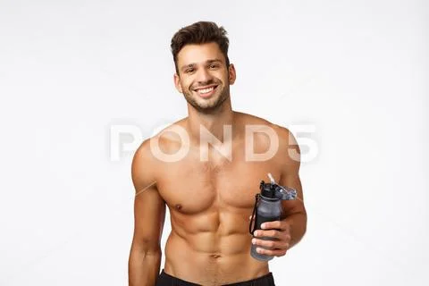 Fitness, health and workout concept. Handsome shirtless man with six-packs Stock Photos