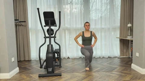 Fitness Instructor Demonstrates Correct Balance Lunge Movements Emphasizing Stock Footage 344249875