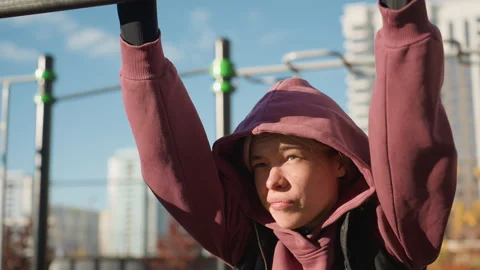 Fitness Instructor Gripping Pullup Bar Under Sunlight Showing Resilience Stock Footage 316643832