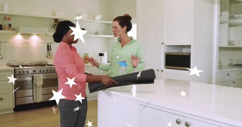 Fitness instructor offering water bottle and yoga mat, guiding client on mat Stock Footage 320125741