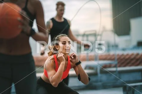 Fitness man and women training on rooftop Stock Photos