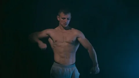 Fitness man on black Stock Footage 94377997