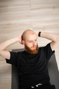 Fitness man doing exercise to train his arm muscles. Active workouts Stock Photos