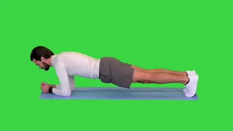 Fitness man doing planking exercise on a Green Screen, Chroma Key. Vídeo Stock 157234740