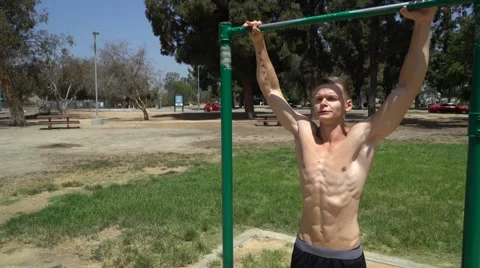 Fitness Man Doing Pull-Ups On Chin-Up Bar Stock Footage 66435101