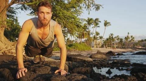 Fitness man doing push-up exercise on beach exercising in summer Stock Footage 62079398
