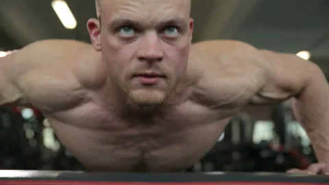 Fitness man doing push ups in gym Stock Footage 140587891