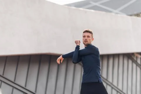Fitness man doing warm up workout. Stock Photos