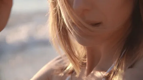 Fitness model in bikini posing on the sea beach at sunset Stock Footage 100286161