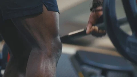 Fitness model doing barbell rows with heavy weight in the gym Stock Footage 89577230