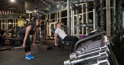 Fitness peoples doing exercise 4k gym video. Weight training workout machine Stock Footage 71797901