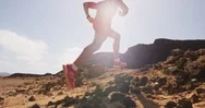 Fitness Running Man Trail Runner In Desert - Male Athlete Running Fast Stock Footage