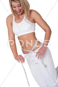 Fitness series - woman measuring her waist Stock Photos