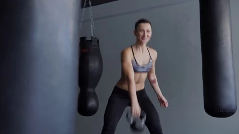 Fitness trainer demonstrates an exercise for the development of muscles. Stock Footage