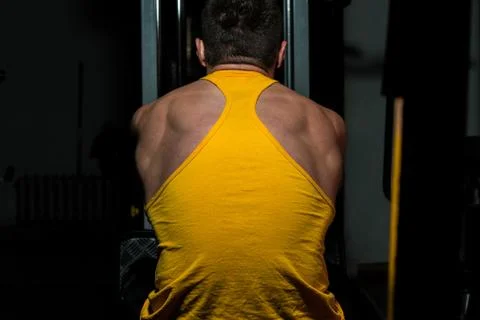 Fitness trainer doing exercise for back Stock Photos