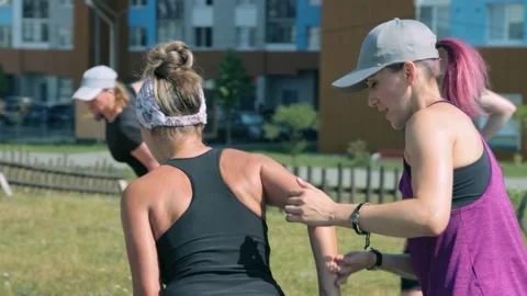 Fitness trainer explaining how to do exercise properly Stock-Footage 138581225