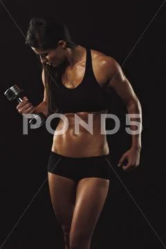 Fitness woman lifting hand weight Stock Photos