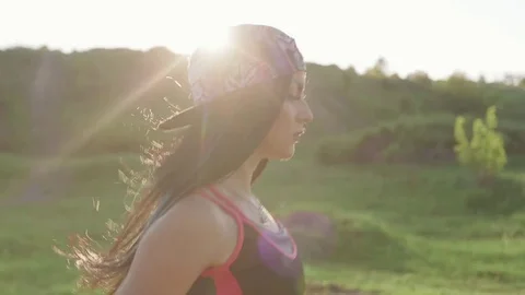 Fitness woman running, beautiful sunset landscape Slow Motion Stock Footage