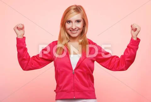 Fitness woman showing energy flexing biceps Stock Photos