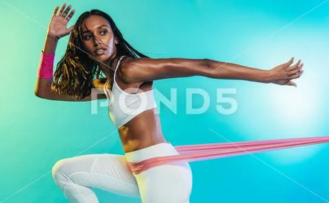 Fitness woman working out with resistance band Stock Photos