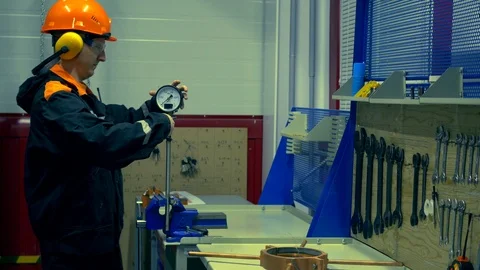 Fitter repairs the pressure gauge Stock Footage 86551932
