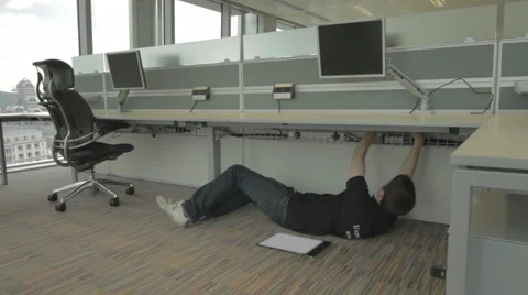 Fitting and Fixing Computer From Under Desk Vídeo Stock 40502775