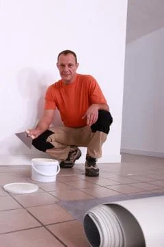 Fitting a carpet Stock Photos