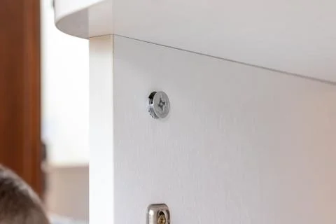 Fitting, fixing or fastener for mounting assembling furniture made of chipboa Stock Photos