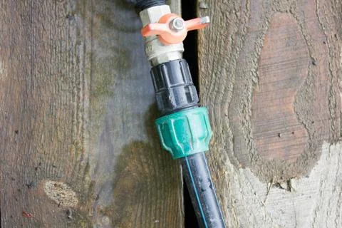 Fitting on a green hose Stock Photos