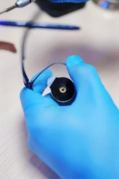 Fitting optical lens into glasses frame Stock Photos