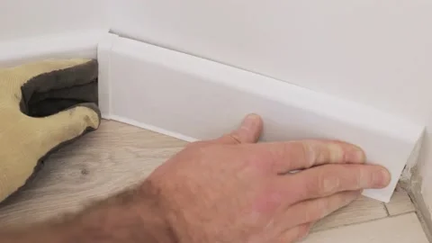 Fitting plinth in the corner - non-standard bevel angle Stock Footage 147172632