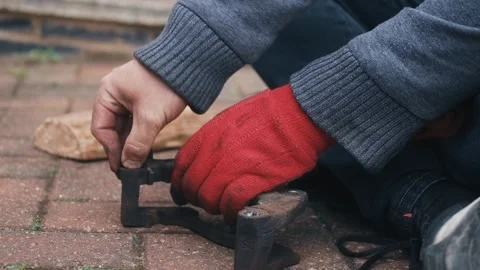 Fitting protective rubber boots onto brake caliper guide pin housings to keep Stock Footage 341568909