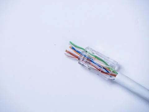 Fitting an RJ45 plug to the end of an Ethernet cable. Stock Photos