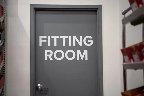 Fitting room door inside a retail store Stock Photos
