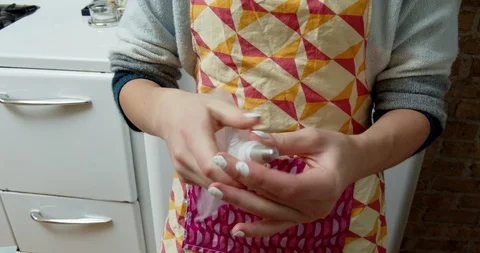 Fitting a tip to a piping bag Stock Footage 117004119
