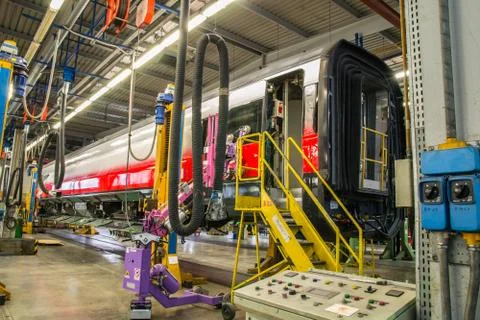 Fitting windows on railway wagon Stock Photos