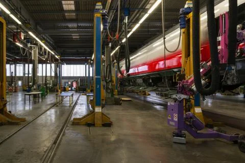 Fitting windows on railway wagon. Stock Photos