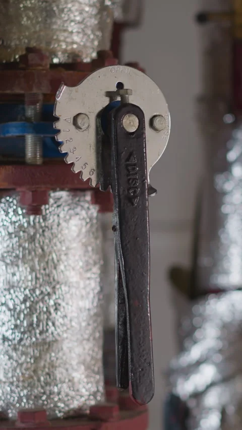 Fittings with foil insulation and levers in boiler house Vídeo Stock 309886019