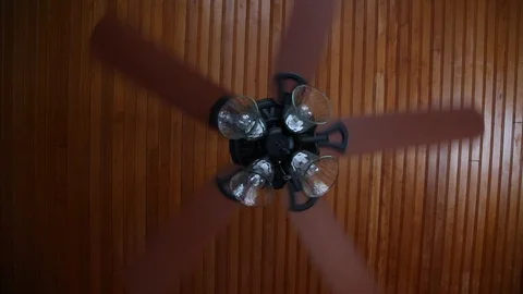 Five (5) blade Ceiling fan on wooden ceiling Stock Footage 129797892