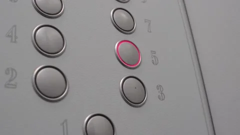 The five "5" floor button lights up red on the dial in the Elevator. Video stock 141852691